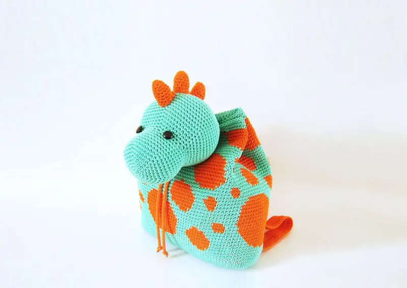 Free Intermediate crochet pattern: Dino Backpack Amigurumi Pattern - Easy to follow tutorial